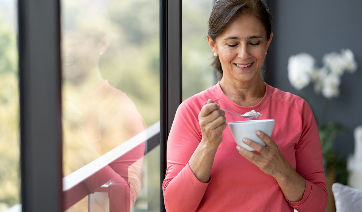 women smiling eating breakfast