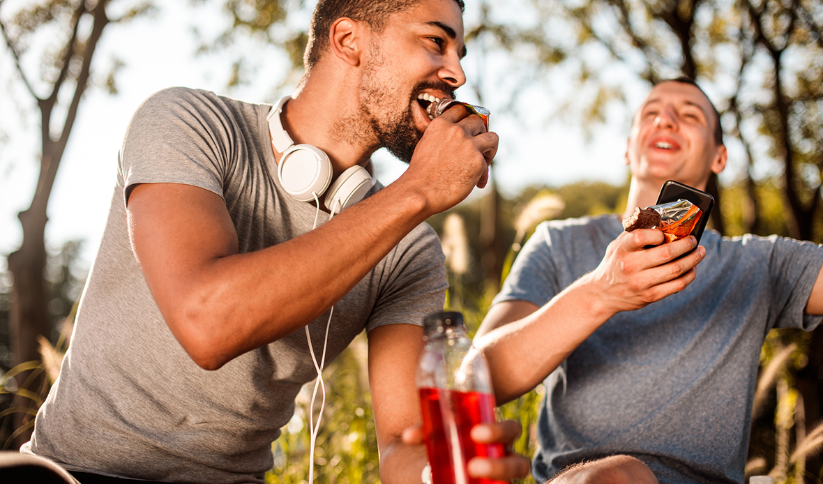 two people eating healthy snacks